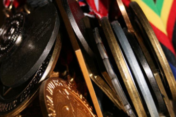 A picture showing a bunch of medals to be awarded for the winners in the sports event