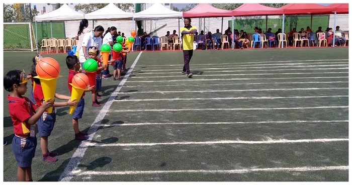 A sports day event in school wherein children are ready on their mark listening for the 'Go' signal from the physical trainer/organizer